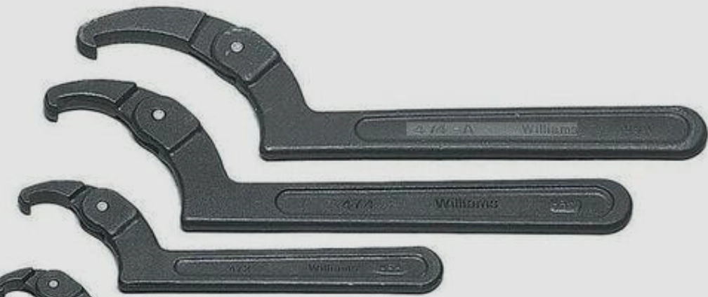 When Should a Hook Spanner Wrench Be Used on Slotted Round Nuts