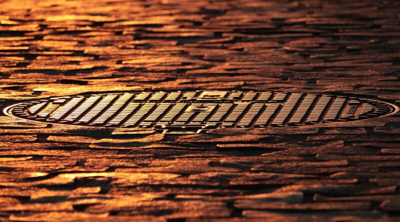 manhole cover, cobblestones, road, pavement, street, manhole cover, road, road, road, road, road, street, street, street, street