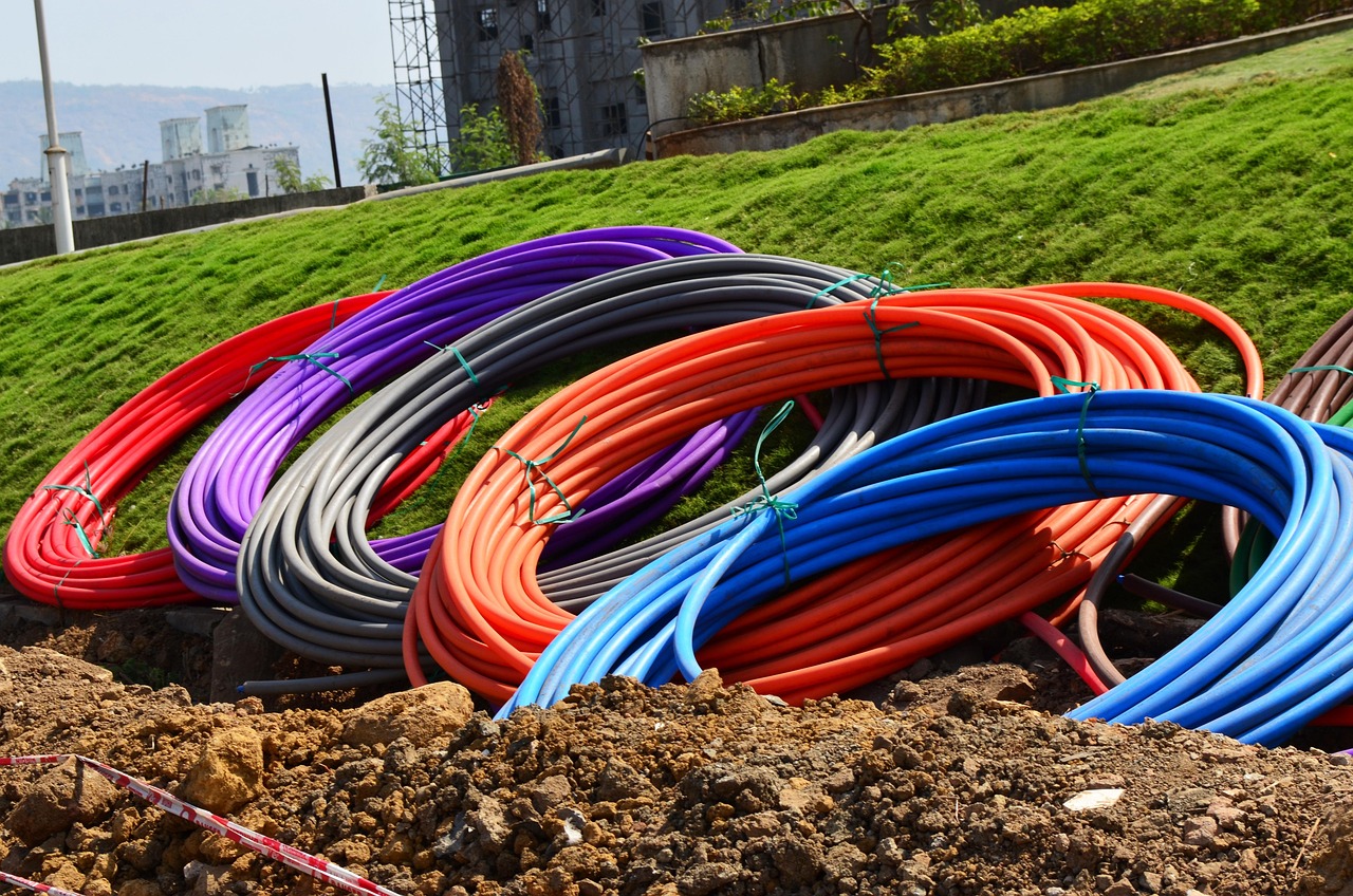 conduit, pipes, coils, rolls, colours, digging, earth, underground, laying, fibre, optical, communication, red, blue, grey, purple, conduit, conduit, conduit, conduit, conduit, digging, digging, digging