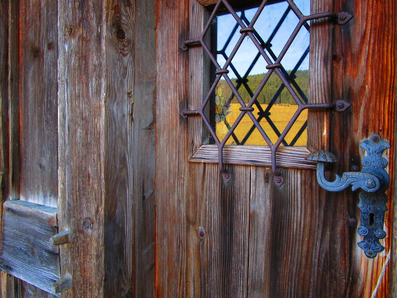 door, fitting, building, wooden door, castle, key hole, wrought iron, old door, reflection, entrance, nostalgia, door handle, wood, metal fitting, ornament, door lock, rustic, historical, brown, weathered, black forest